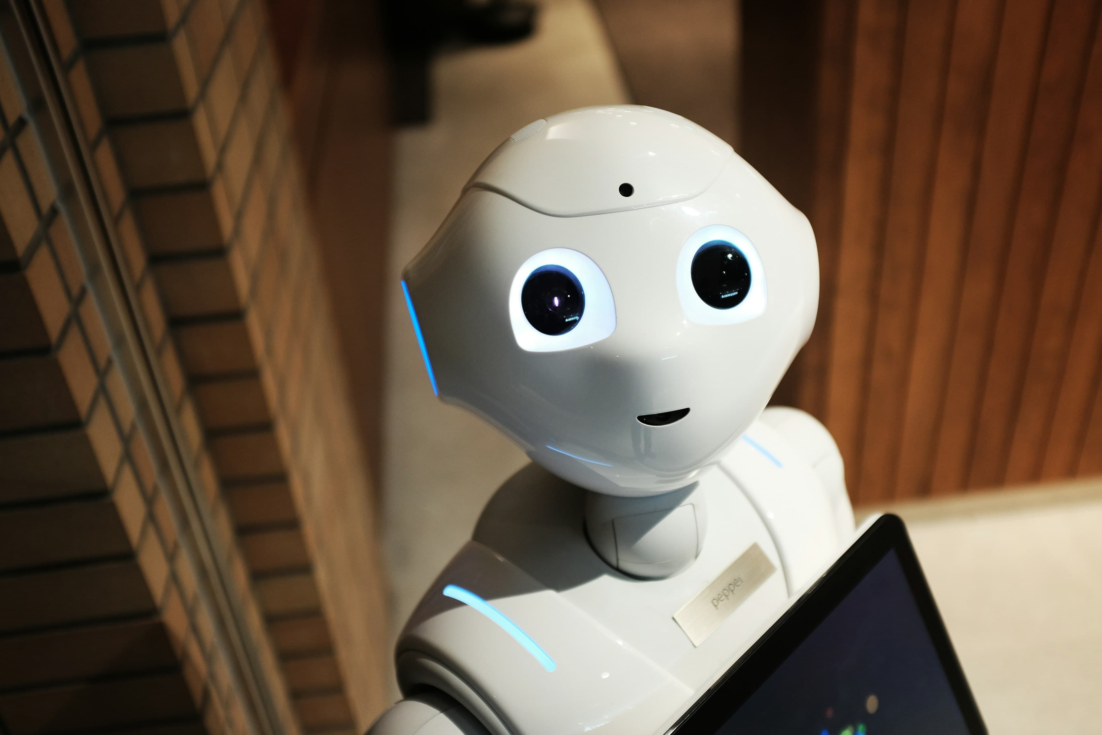 Friendly humanoid robot assistant looking at the camera